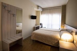 Rúm í herbergi á Hotel Scacciapensieri