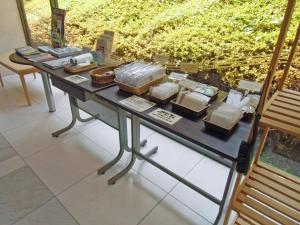 a table with several baskets of food on it at Hotel Oaks Early-Bird Osaka Morinomiya/ Vacation STAY 28691 in Osaka