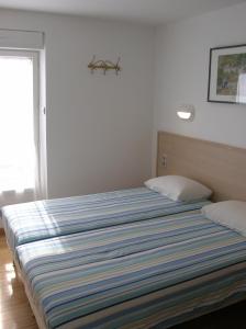 Postel nebo postele na pokoji v ubytování Hotel Darcet