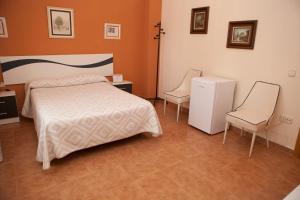 Posteľ alebo postele v izbe v ubytovaní La Rosaleda de Orgaz