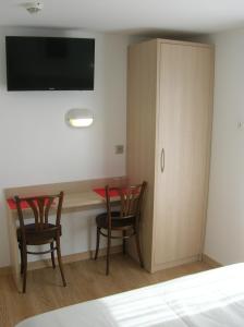 Postel nebo postele na pokoji v ubytování Hotel Darcet