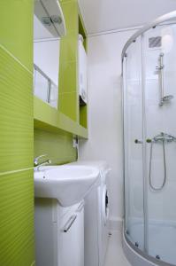 Kylpyhuone majoituspaikassa Apartament Deluxe Arcon