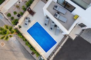 an overhead view of a house with a swimming pool at Luxury Apartment La Mer in Murter