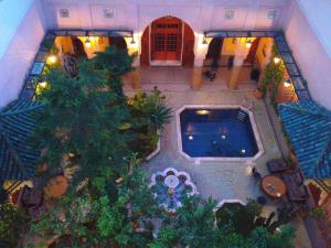an overhead view of a courtyard with a swimming pool at Riad Jaouhara in Fès