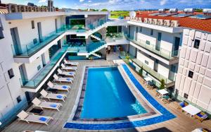 an overhead view of a swimming pool in a building at Sunway Hotel in Kallithea Halkidikis