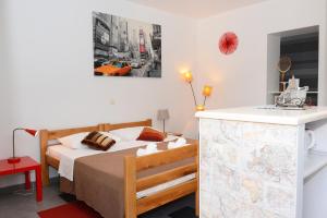Postel nebo postele na pokoji v ubytování Apartments Oaza