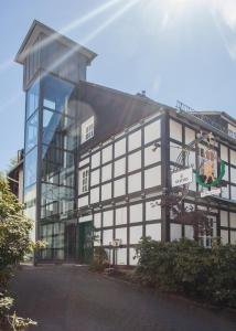 a black and white building with a glass facade at Boutique-Hotel Weigels Bergfreiheit in Winterberg