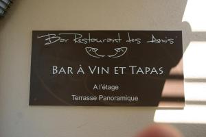 a sign on a wall that says bar a vin et tacos at HOTEL CAMPOMORO in Belvédère-Campomoro