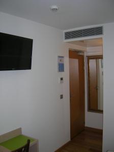 TV a/nebo společenská místnost v ubytování Hotel Darcet