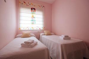 Posteľ alebo postele v izbe v ubytovaní Playa del Cantil, 3 bedrooms and 2 free parking