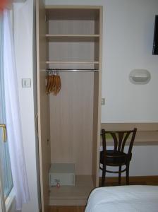 Postel nebo postele na pokoji v ubytování Hotel Darcet