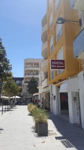 a building with a sign that reads hospital eye surgery at Hostal Can Joanet in Cambrils