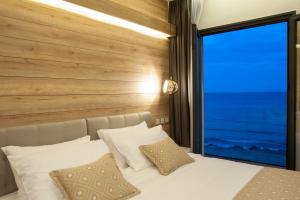 Voodi või voodid majutusasutuse Seasabelle Hotel near Athens Airport toas
