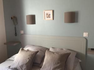 Postel nebo postele na pokoji v ubytování Hotel Le Méditérranée