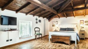 A bed or beds in a room at Relais Valpolicella B&B