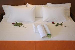 Postel nebo postele na pokoji v ubytování Elysee Hotel