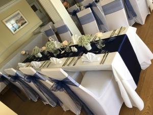 a white table with umbrellas on top of it at Grand Hotel Swanage in Swanage +37 photos