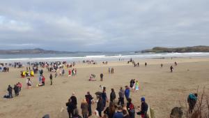 a large group of people standing on a beach at Willow house Eircode F92V67T No kitchen no washing machine at this time available in Letterkenny