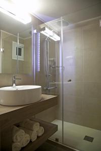 Ett badrum på Elysee Hotel