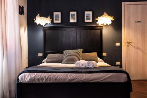 a bedroom with a bed and a lamp at Corso 151 in Olbia