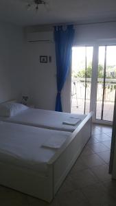 Posteľ alebo postele v izbe v ubytovaní Apartment Elena