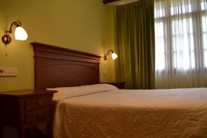 Cama o camas de una habitación en Casas Rurales Las Corradas
