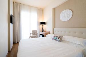Postel nebo postele na pokoji v ubytování Hotel Joseph