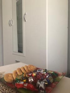 a plate of food on a table with cookies at Pokoje Wrzeszcz in Gdańsk