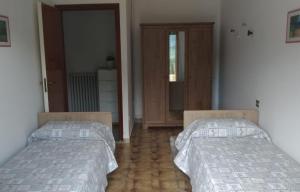 A bed or beds in a room at Casa Vacanze Breva
