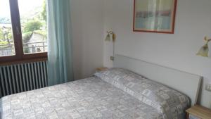 A bed or beds in a room at Casa Vacanze Breva