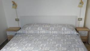 A bed or beds in a room at Casa Vacanze Breva