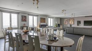 a dining room with a table and chairs at Le Notre Dame - Luxury Apartment with Seine View in Paris