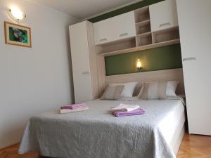 Postel nebo postele na pokoji v ubytování Rooms Neda