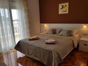 Postel nebo postele na pokoji v ubytování Rooms Neda