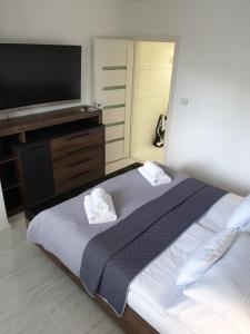 Posteľ alebo postele v izbe v ubytovaní Apartmány Urban