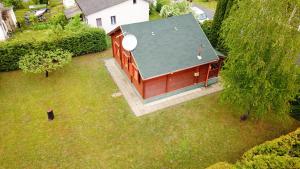 an overhead view of a barn with a green roof at Lake House Farsang in Balatonberény