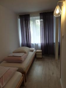Katil atau katil-katil dalam bilik di Mieszkanie dla 3-6 osób