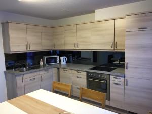 Kuchyň nebo kuchyňský kout v ubytování Family friendly Apartment in the heart of Interlaken