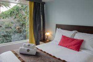Postel nebo postele na pokoji v ubytování Hotel Shalom