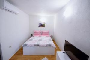 Posteľ alebo postele v izbe v ubytovaní Apartman Sea view