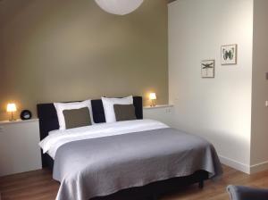 Postel nebo postele na pokoji v ubytování B&B De Veluwe Hoeve