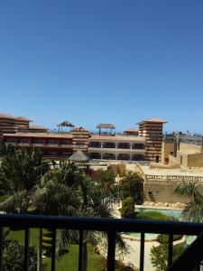 a view from the balcony of a resort with a train at 321or322 the finest Porto Marina Chalets Tower 3 in El Alamein