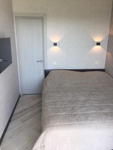 Ένα ή περισσότερα κρεβάτια σε δωμάτιο στο Apartament West Side