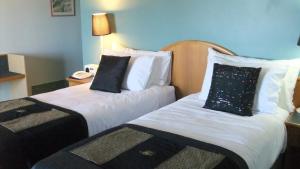 Katil atau katil-katil dalam bilik di Heritage Resort Shark Bay