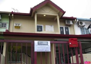 a house with a gate with a sign on it at The One Vacation Home in Malacca