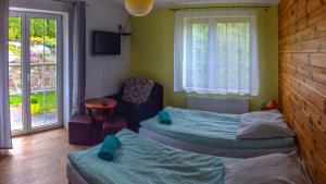 Ένα ή περισσότερα κρεβάτια σε δωμάτιο στο B&B Villa Varmia