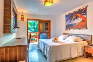 Cama ou camas em um quarto em Pousada Vila do Dengo mais 37 fotos