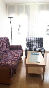 a living room with a couch and a coffee table at Gare de Madrid in Madrid