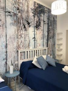 Ένα ή περισσότερα κρεβάτια σε δωμάτιο στο giolitti central room