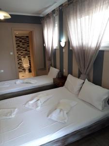 Posteľ alebo postele v izbe v ubytovaní Kostalina Hotel Studios
